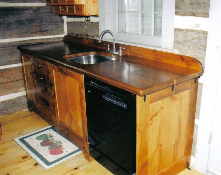Installed kitchen counter top and cupboard.